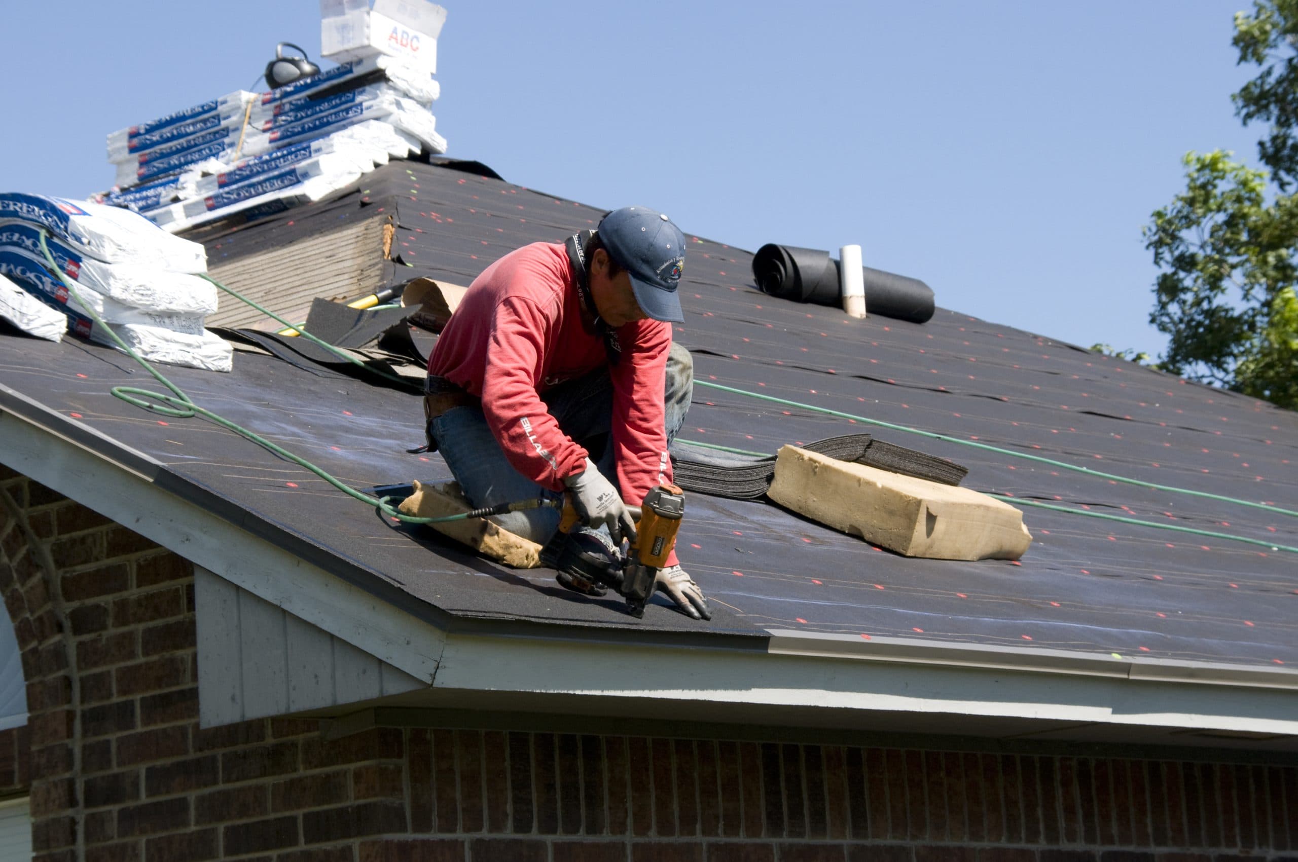 Roofer working on roof